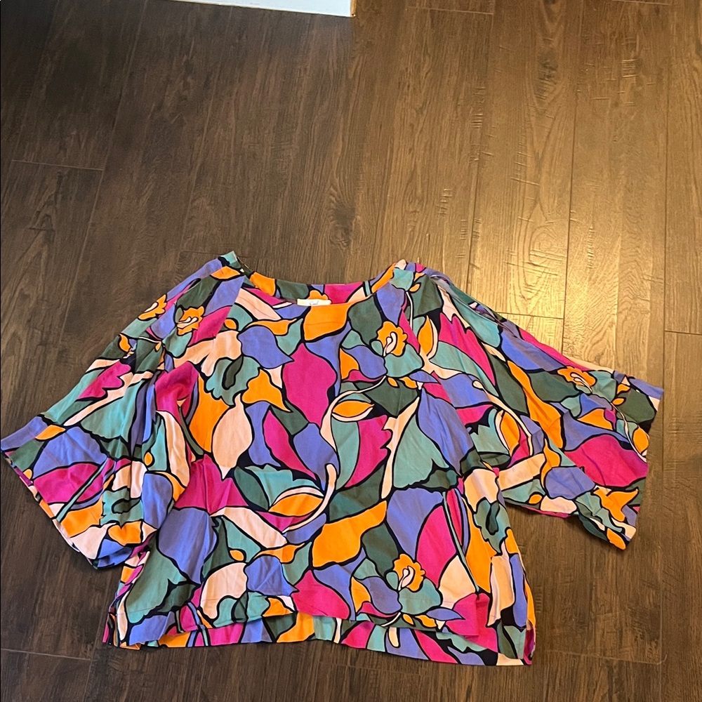 Easel brand
Dress blouse with cold shoulder 
Size M
Multi colors